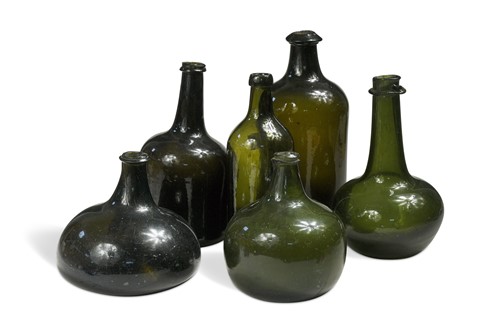 Lot 346 - A group of six green glass bottles, 18th century and later