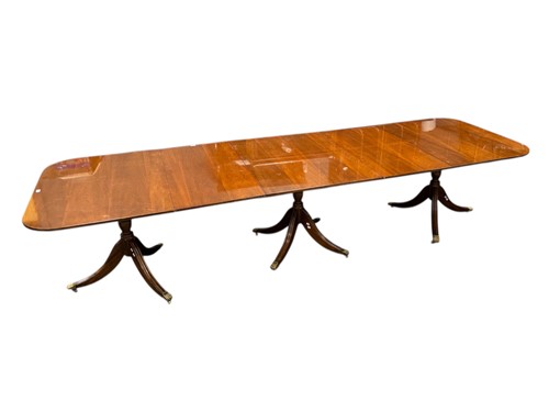 Lot 458 - A Regency style triple pedestal dining table,...