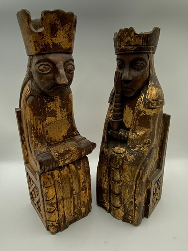 Lot 142 - Two carved and gilt seated figures, after...