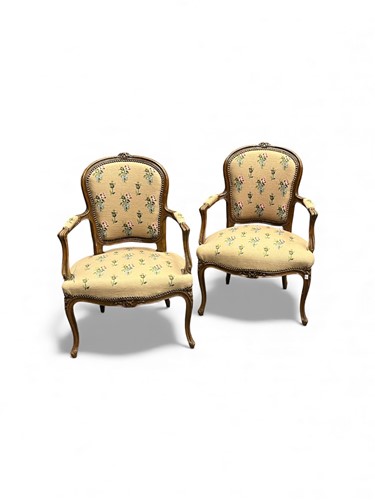 Lot 376 - A pair of Louis XV style fauteuils or open...