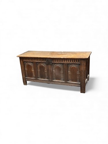 Lot 683 - A carved oak four panelled coffer, late 17th...