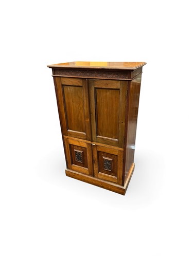 Lot 675 - An Arts & Crafts style walnut cupboard, 20th...