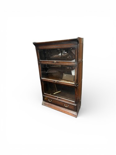 Lot 765 - An oak sectional stacking bookcase, 20th...