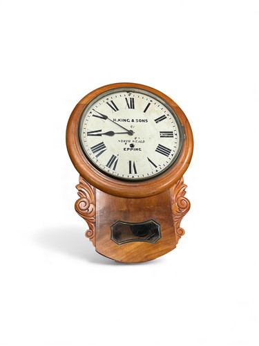 Lot 618 - A mahogany wall clock, the twelve inch white...