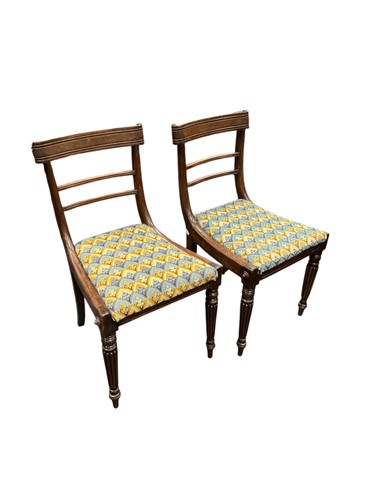 Lot 411 - A set of four William IV mahogany dining...