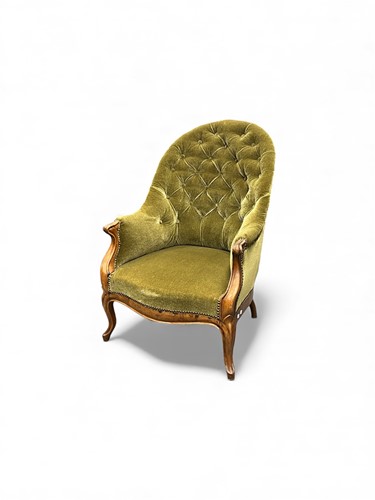 Lot 647 - A Victorian mahogany bergere chair with green...