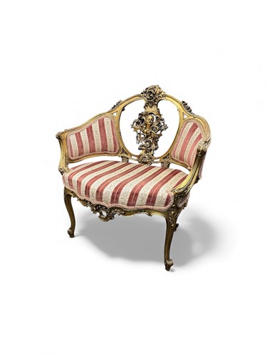 Lot 789 - A French Louis XV style gilt armchair, with...