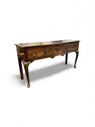Lot 706 - An elm dresser base, 18th century, with three...