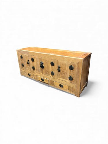 Lot 741 - An Eastern elm side cabinet, with a...