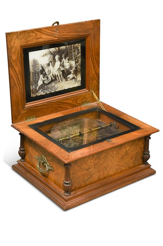 Lot 694 - A walnut and marquetry lid disc musical box, circa 1900
