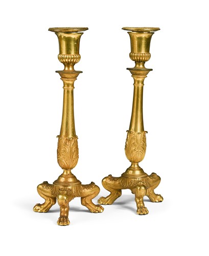 Lot 541 - A pair of French Empire Neo-Classical ormolu tripod candlesticks