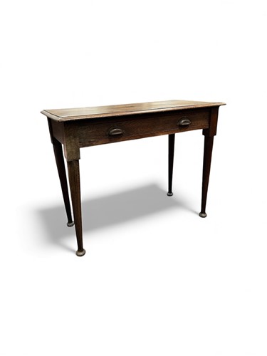 Lot 738 - An oak side table, circa 1920, fitted a drawer...