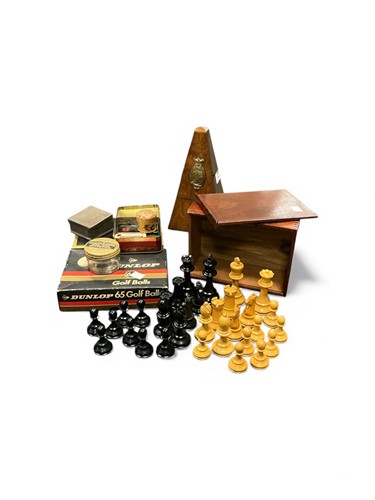 Lot 34 - A metronome, a boxwood chess set in a box, and...