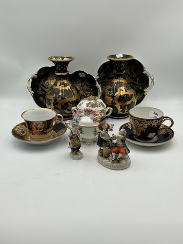 Lot 208 - A pair of black glass and gilded vases,...