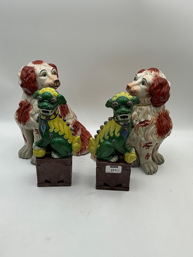 Lot 106 - A pair of Staffordshire spaniels, 28cm high...
