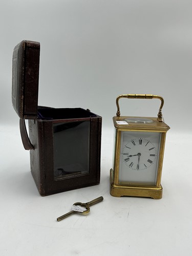 Lot 215 - A French brass carriage clock by Henri Jacot,...