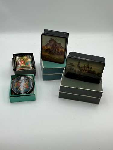 Lot 228 - Four Russian lacquer boxes painted with scenic...