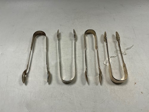 Lot 296 - Four pairs of hallmarked silver sugar tongs,...