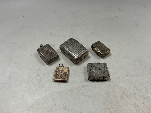 Lot 289 - A group of five hallmarked silver vinaigrettes...