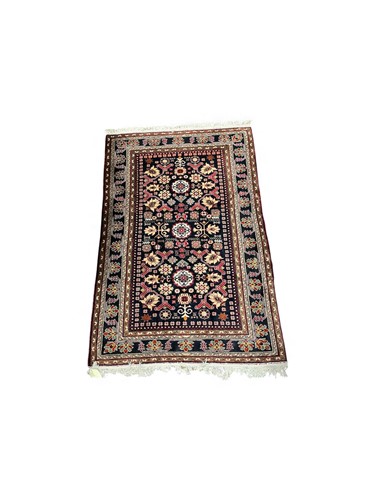 Lot 810 - A modern blue ground patterned wool rug, 205 x...