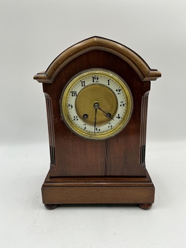 Lot 244 - An Edwardian mahogany arch top mantel clock...