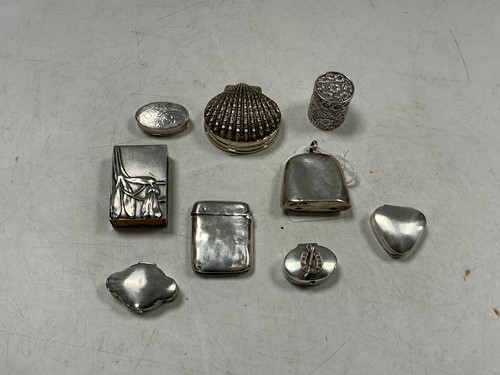 Lot 353 - A collection of nine silver novelty items, to...
