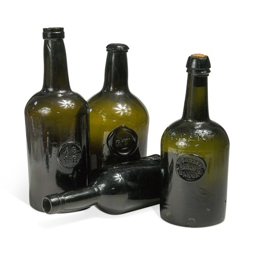 Lot 317 - A green glass bottle manufactured by Powel & Ricketts of Bristol, 19th century