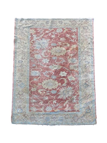Lot 827 - A Zeigler style wool rug, the pale ground with...