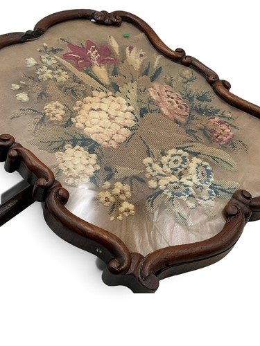 Lot 257 - A rosewood polescreen with floral needlepoint...