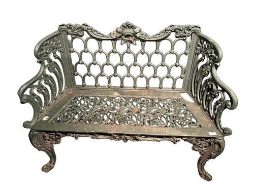 Lot 722 - A pierced green painted cast iron garden bench...