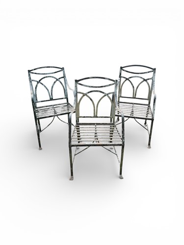 Lot 468 - Three heavy steel garden armchairs in the...