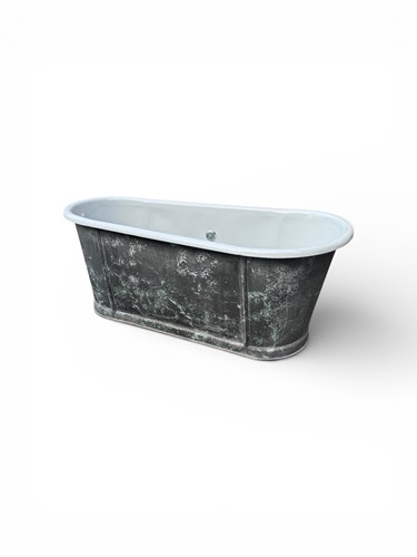 Lot 399 - An enamel painted metal bath, oval form with...