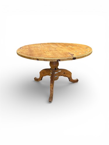 Lot 611 - A pine centre table, modern, the circular top...