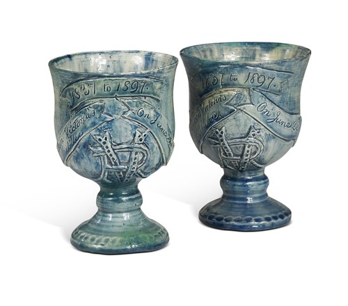 Lot 28 - Castle Hedingham, a matched pair of commemorative pottery goblets