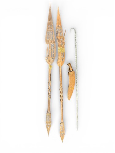 Lot 191A - Two tribal carved wood paddles, a glass cane...