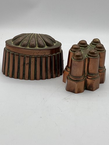 Lot 115 - Two 19th century copper jelly moulds, one with...