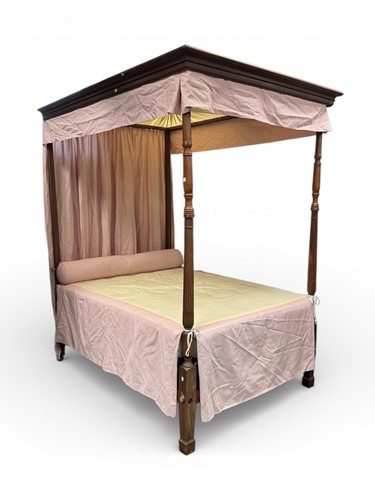Lot 472 - A four poster mahogany bed with overhead...