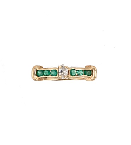 Lot 95 - A marquise cut diamond ring with emerald set shoulders