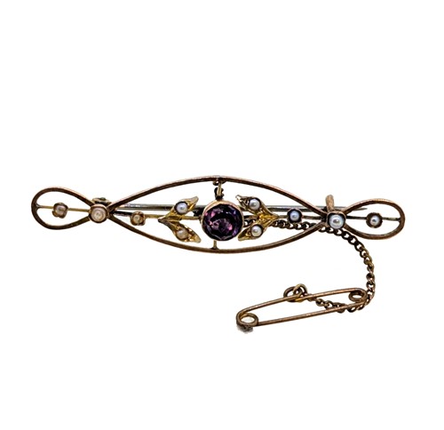 Lot 21 - An amethyst and split pearl brooch