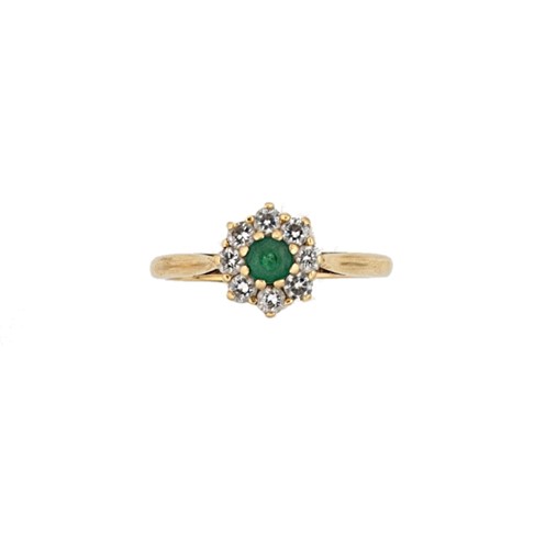 Lot 104 - An 18ct gold emerald and diamond cluster ring