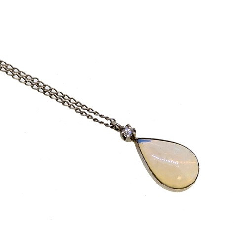 Lot 23 - An opal and diamond pendant and chain