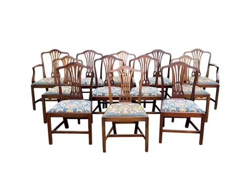 Lot 457 - A set of twelve Hepplewhite style mahogany...