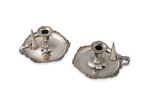 Lot 378 - A matched pair of Victorian and Edwardian silver chambersticks