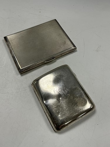 Lot 172 - A hallmarked silver engine turned cigarette...
