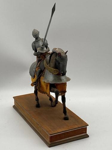 Lot 62 - A model of a knight on horseback, mounted to a...