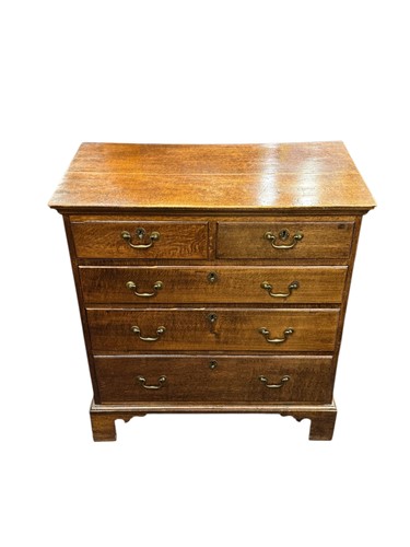 Lot 391 - A small George III oak chest of drawers, two...