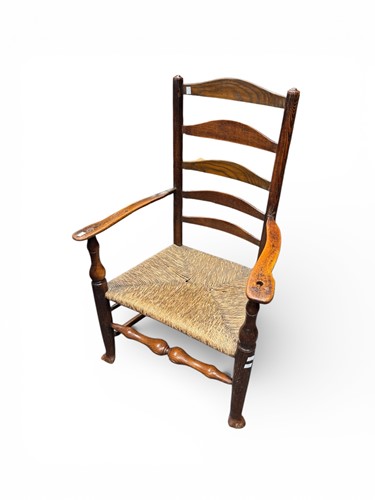 Lot 369 - A large oak ladder back chair with rushed seat,...