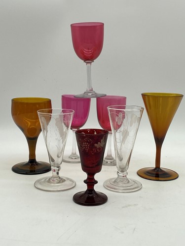 Lot 1 - Three cranberry glasses, a pair of ale flutes...