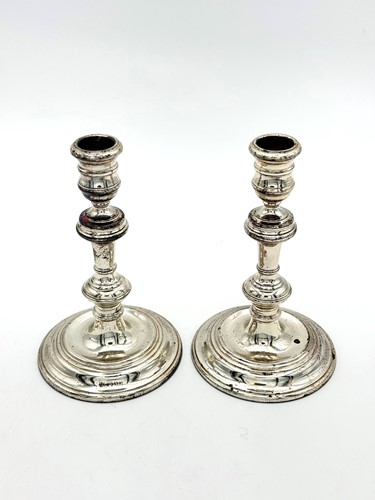 Lot 47 - A pair of silver candlesticks