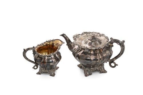 Lot 118 - A 19th century silver plated teapot and milk jug